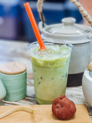 a matcha latte with the tools to make one. 