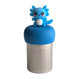 A silver cylindrical speaker with a blue top cap, featuring a cute blue axolotl figurine sitting on the cap. The speaker has a perforated silver body with the brand name 'FLOAT?INFUSE' debossed on the front.