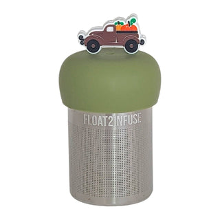 Stainless steel mesh infuser with green lid and decorative truck on a white background