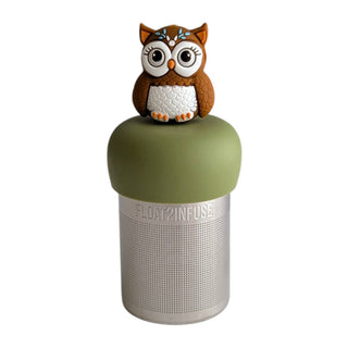 A floating infuser bottle with an olive green top and a brown owl figurine sitting on it, set against a plain white background.